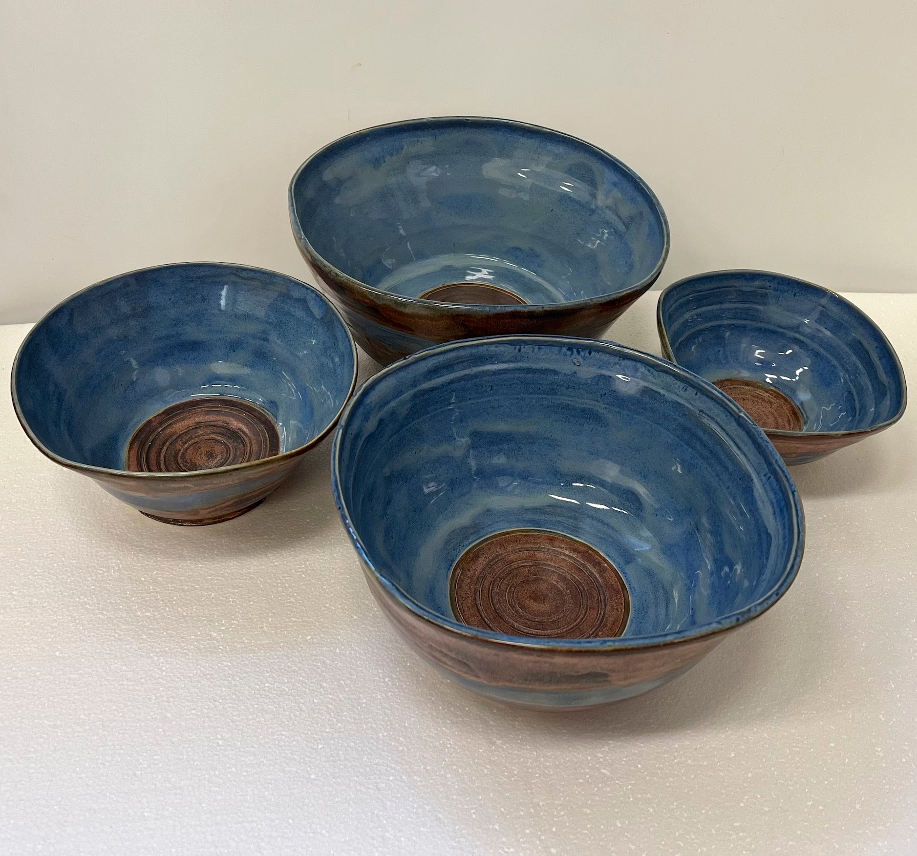 4 stacked bowls blue copper