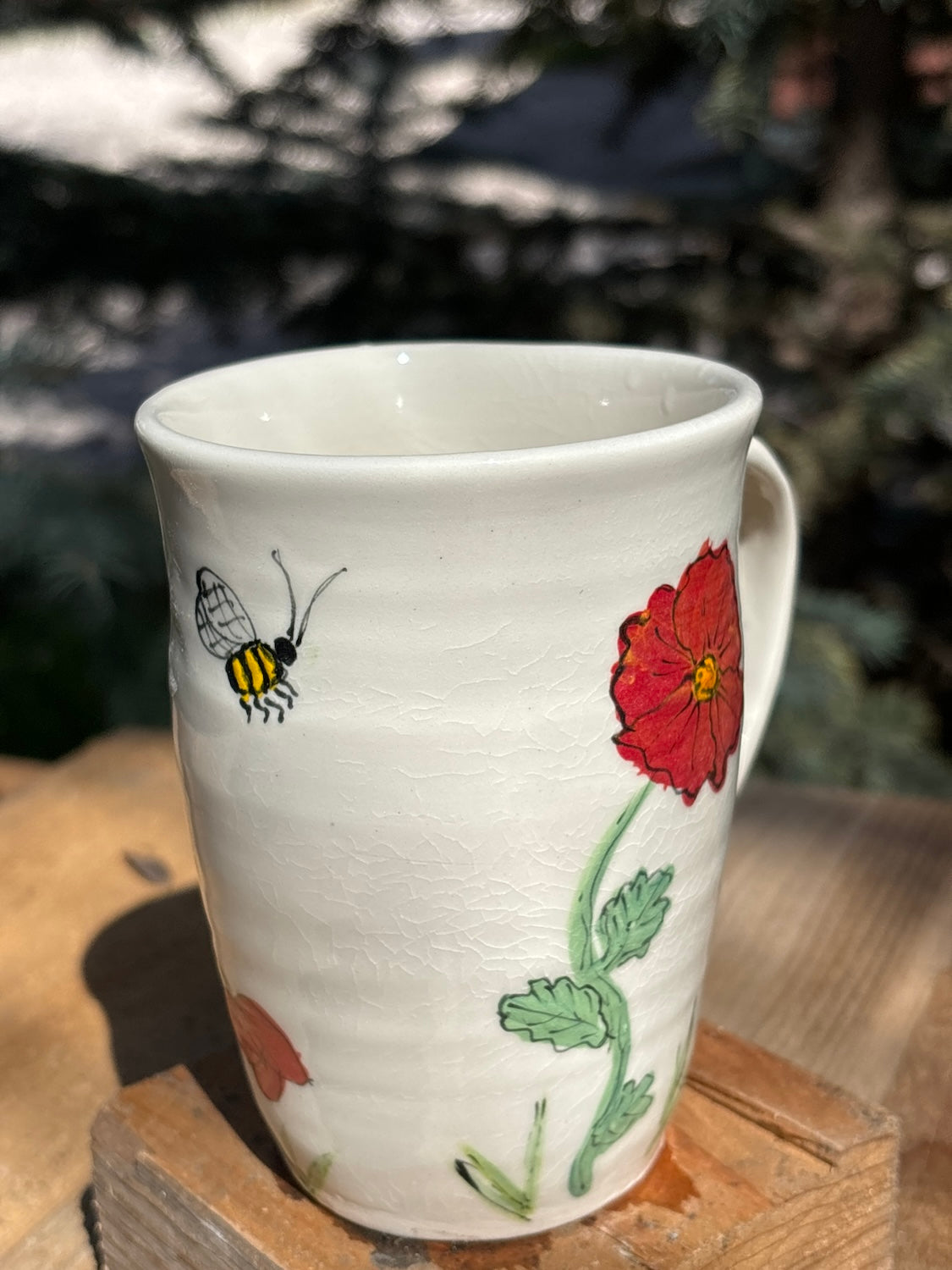 Red poppy mug with bumblebee