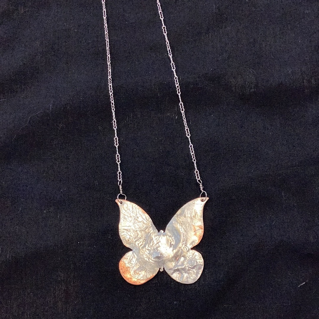 Melted butterfly pendant necklace