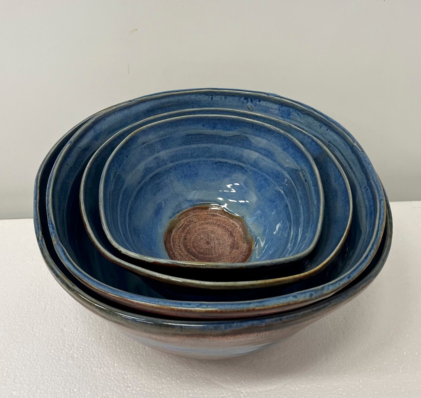 4 stacked bowls blue copper