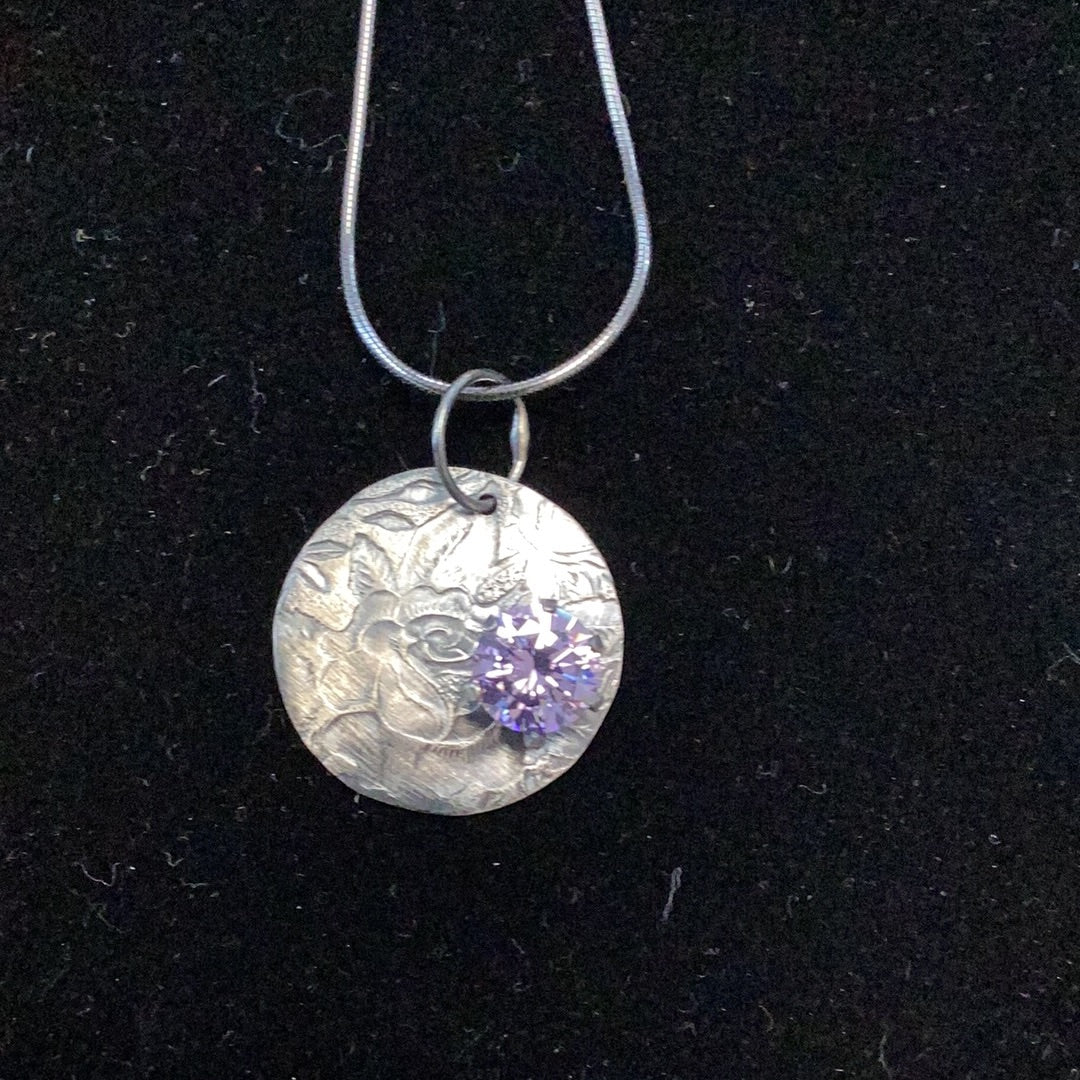 Oxidized sterling silver textured coin pendant with purple cz