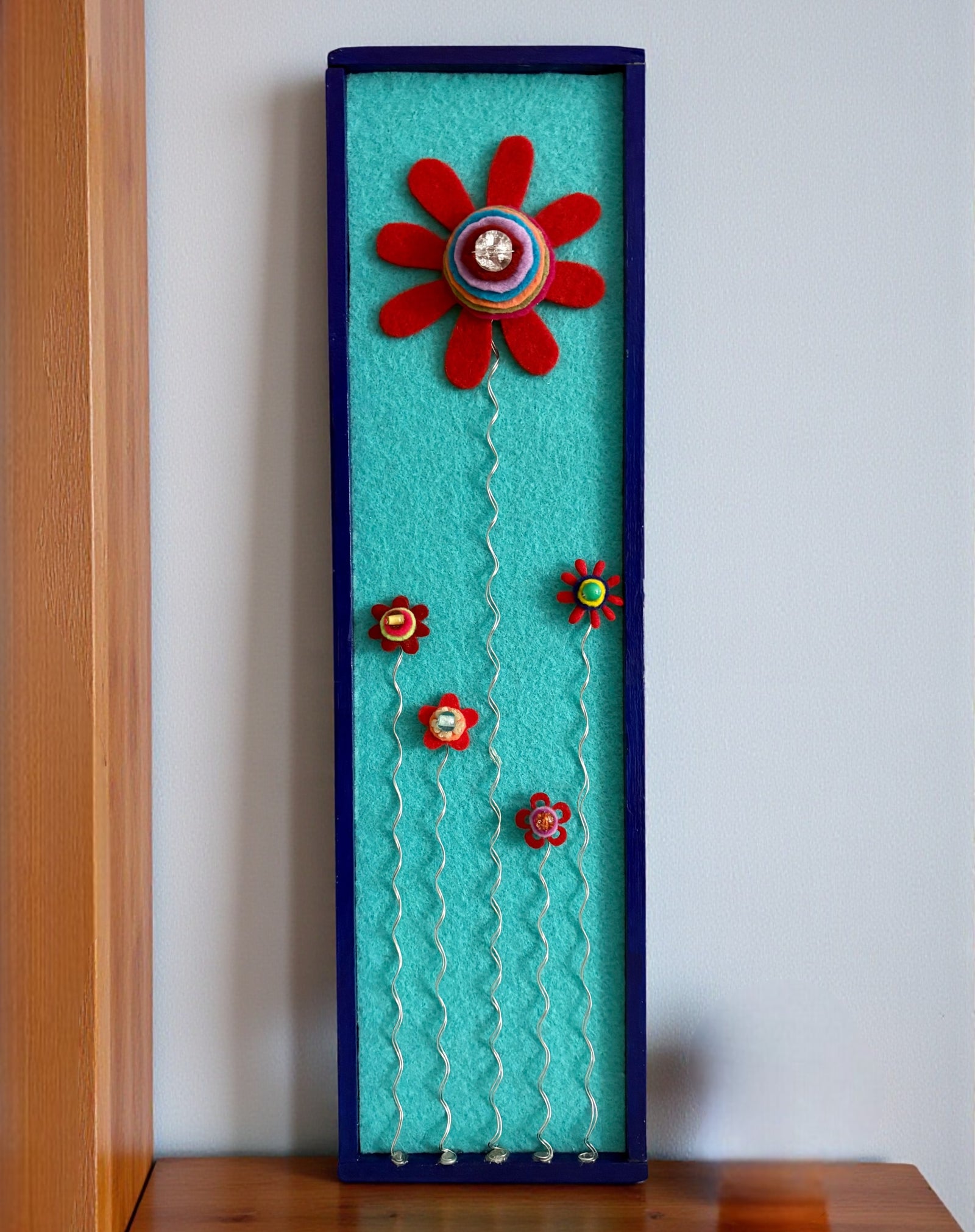 Blue Frame with 5 Red Flowers