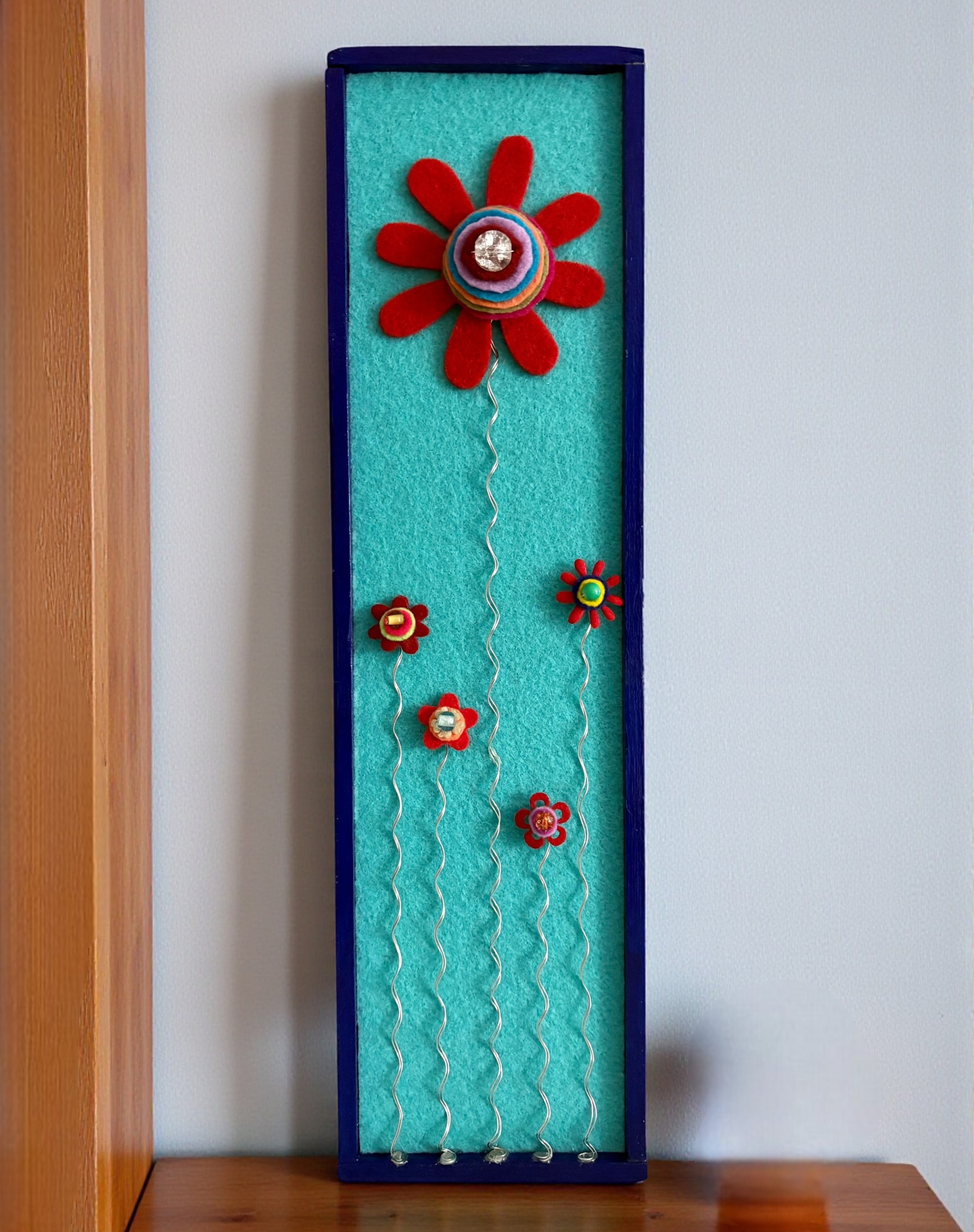 Blue Frame with 5 Red Flowers