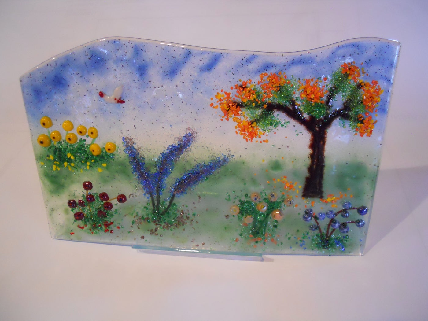 Glass Flowering meadow with a flowering tree