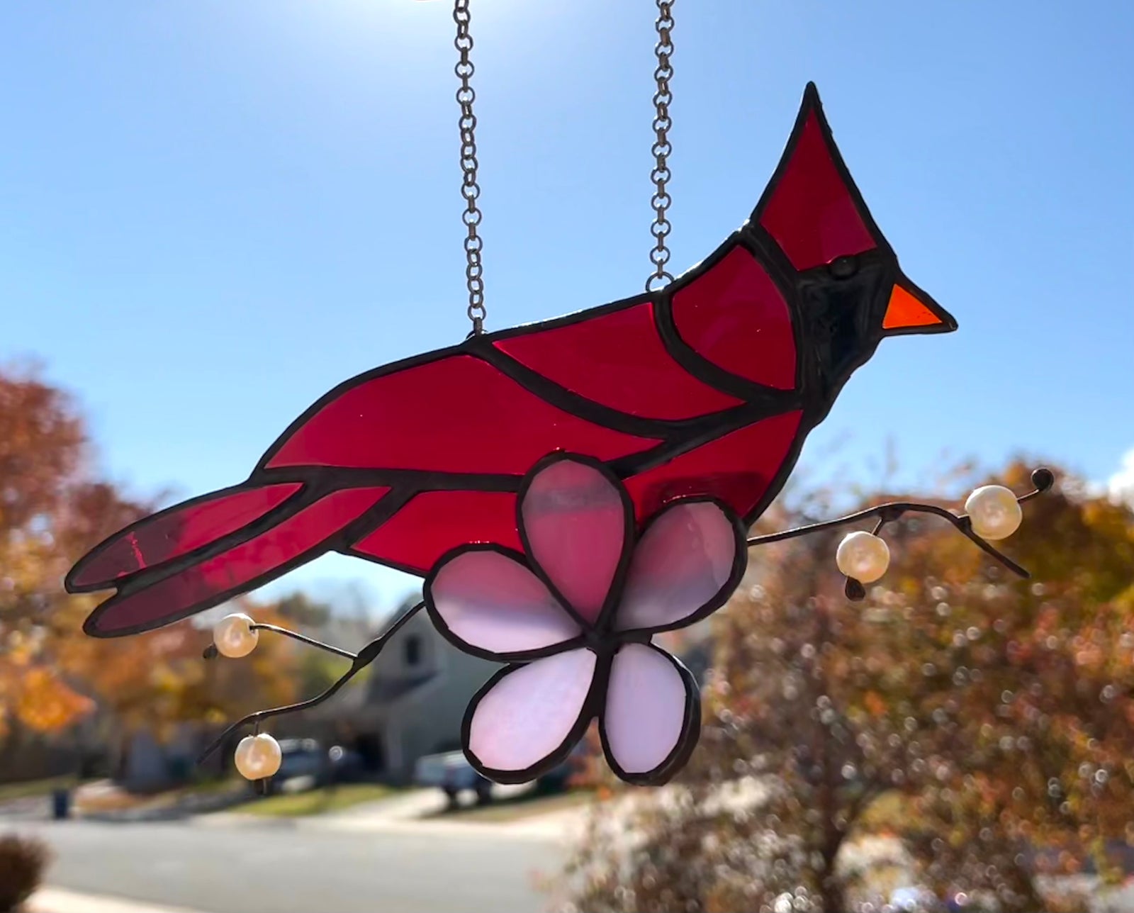 Cardinal with purple flower