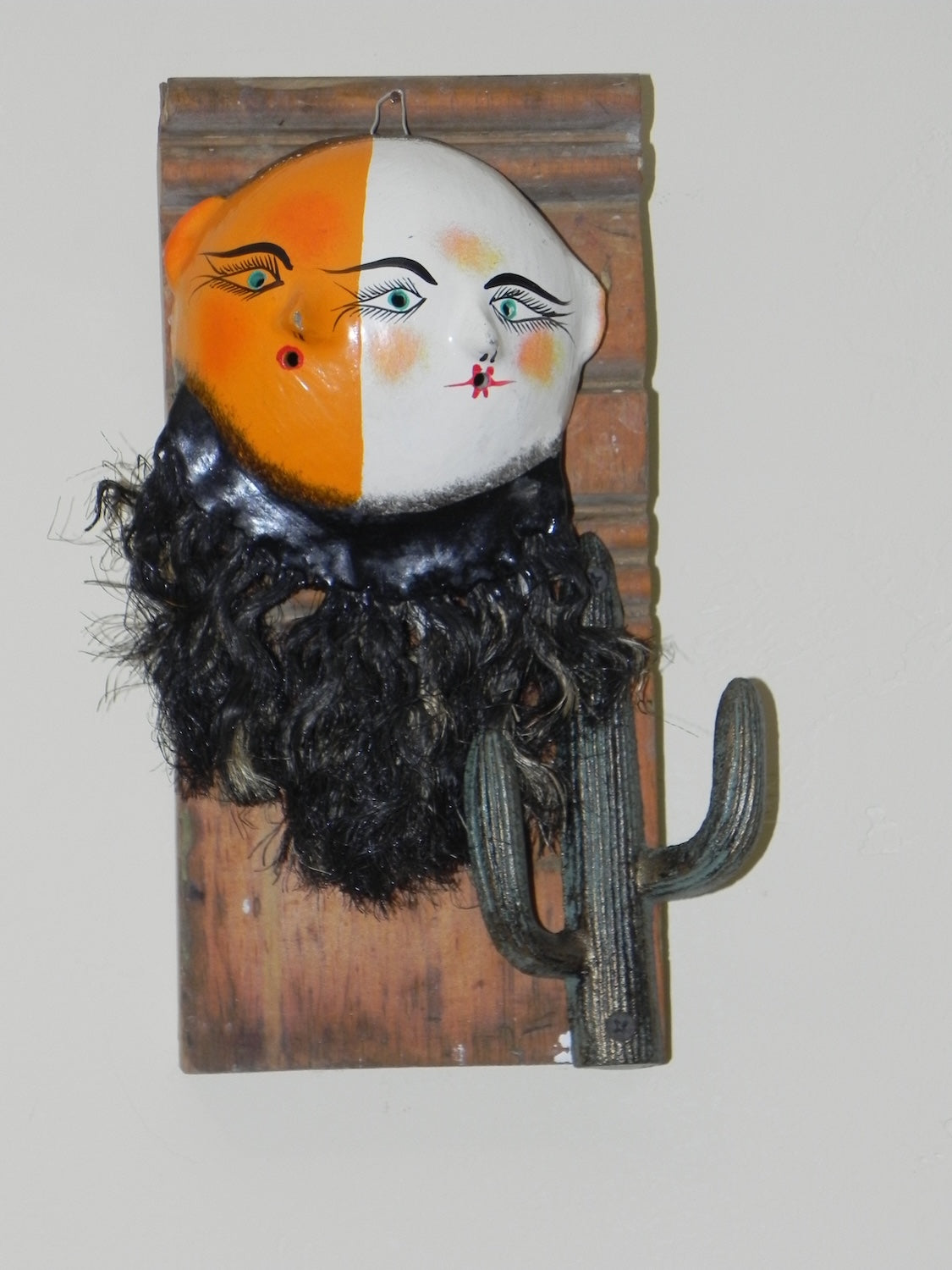 Mexican coconut shell mask hanger