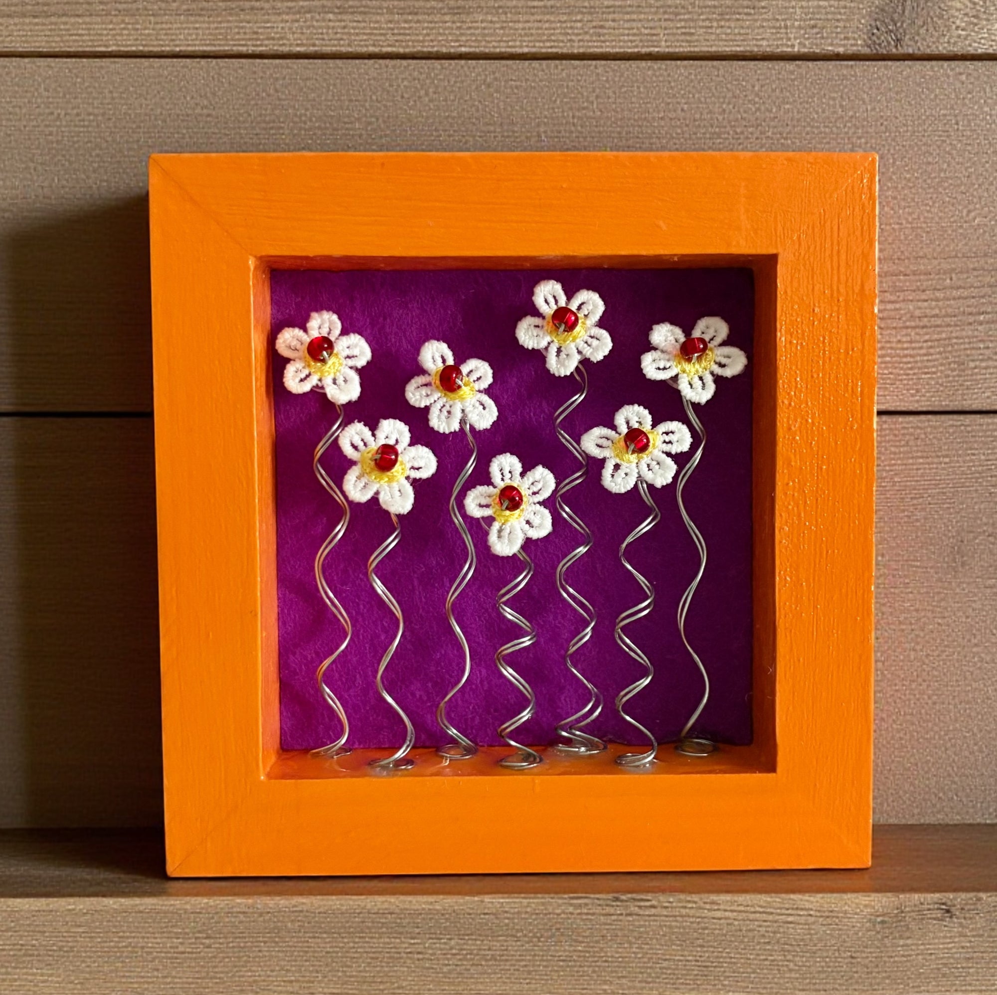 Orange Frame with 7 Daisies