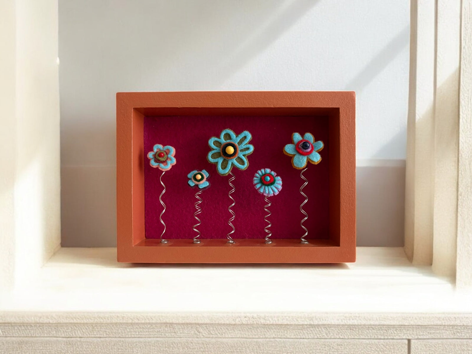 Orange Shadow Box Frame with 5 Blue Flowers