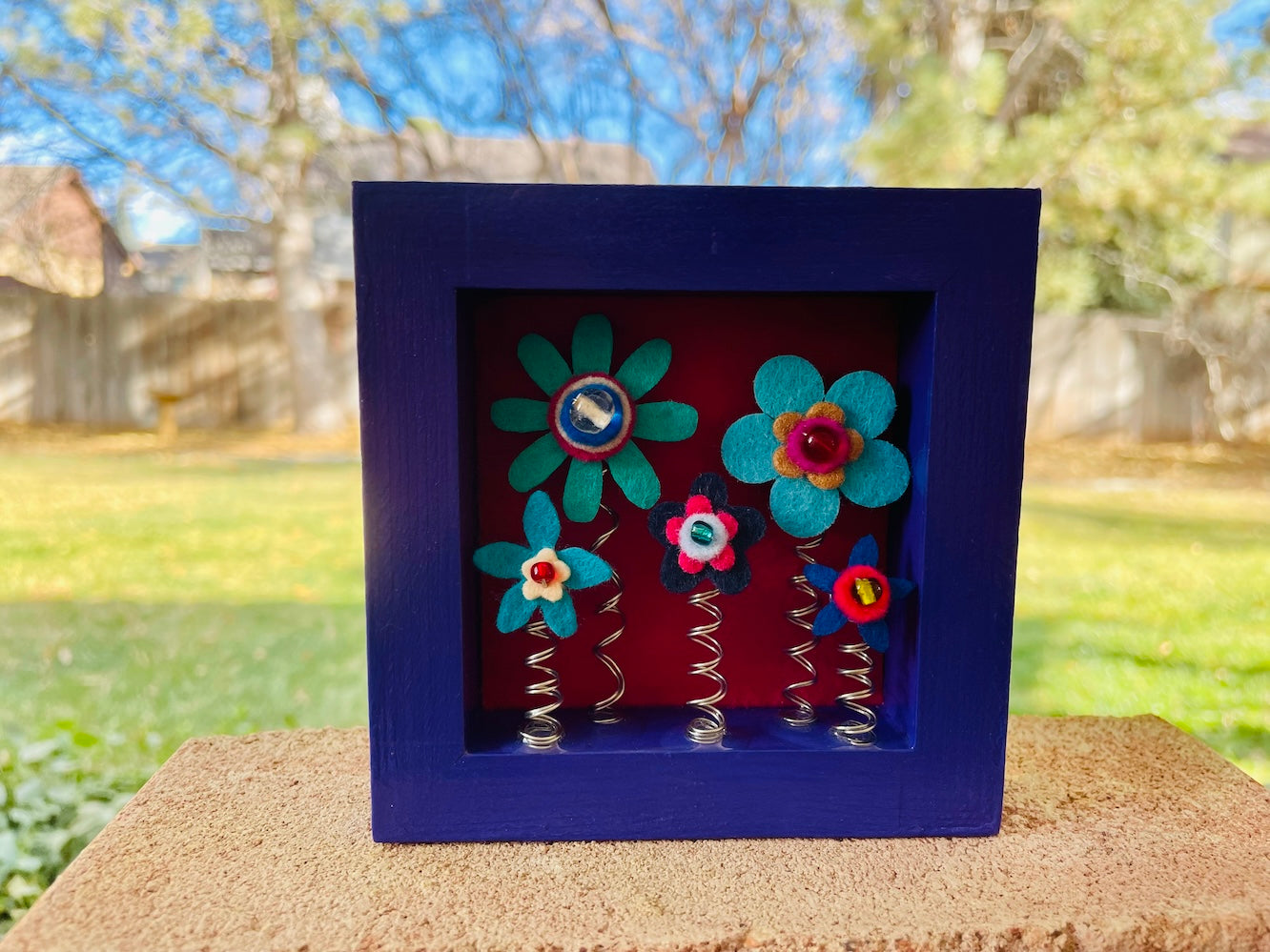 Purple Shadow Box with 5 Blue Felt Flowers