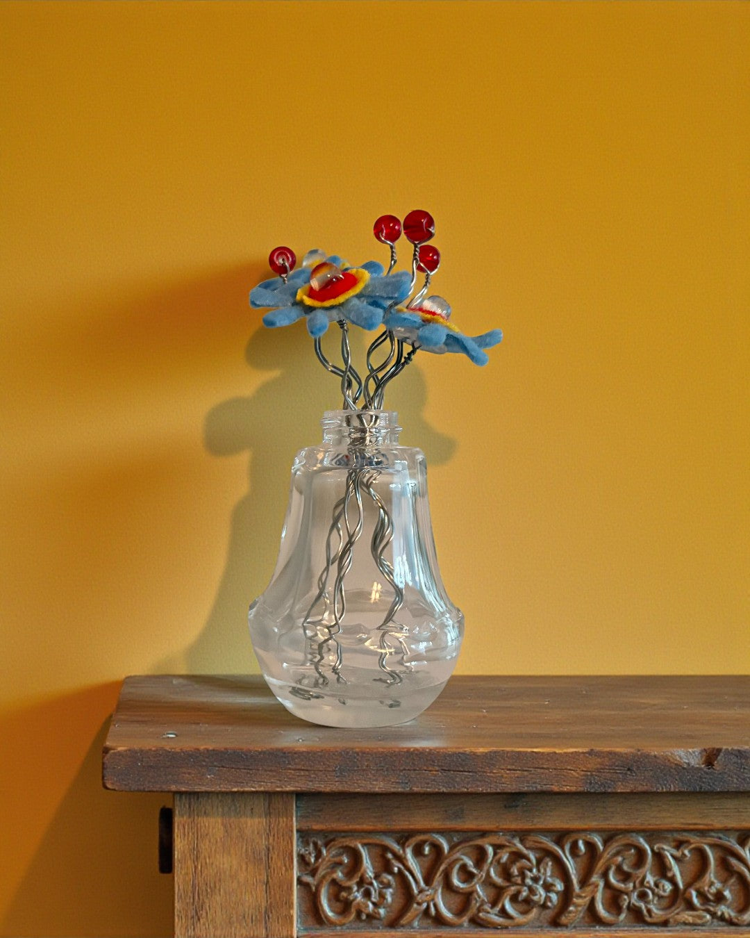 Vase with Blue and Yellow Flowers and Red Beads