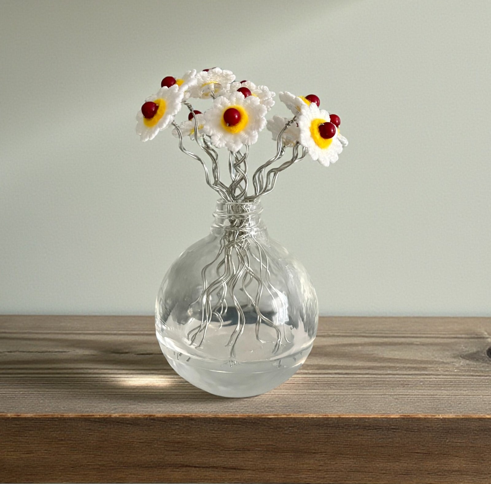 Vase with White and Yellow Flowers and Red Beads