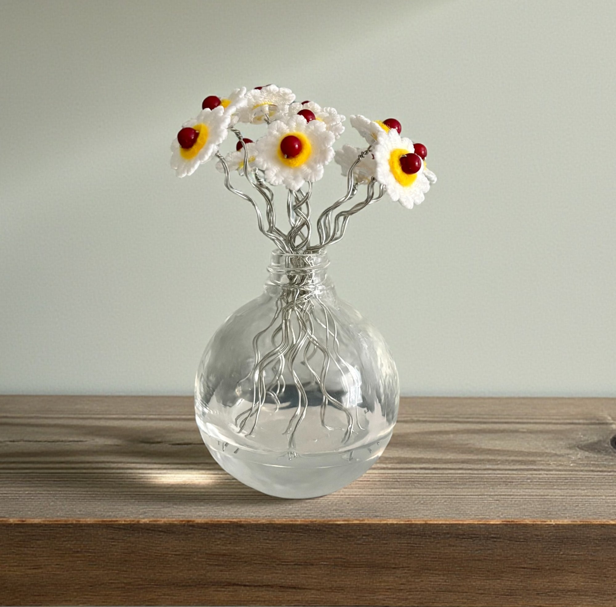Vase with White and Yellow Flowers and Red Beads