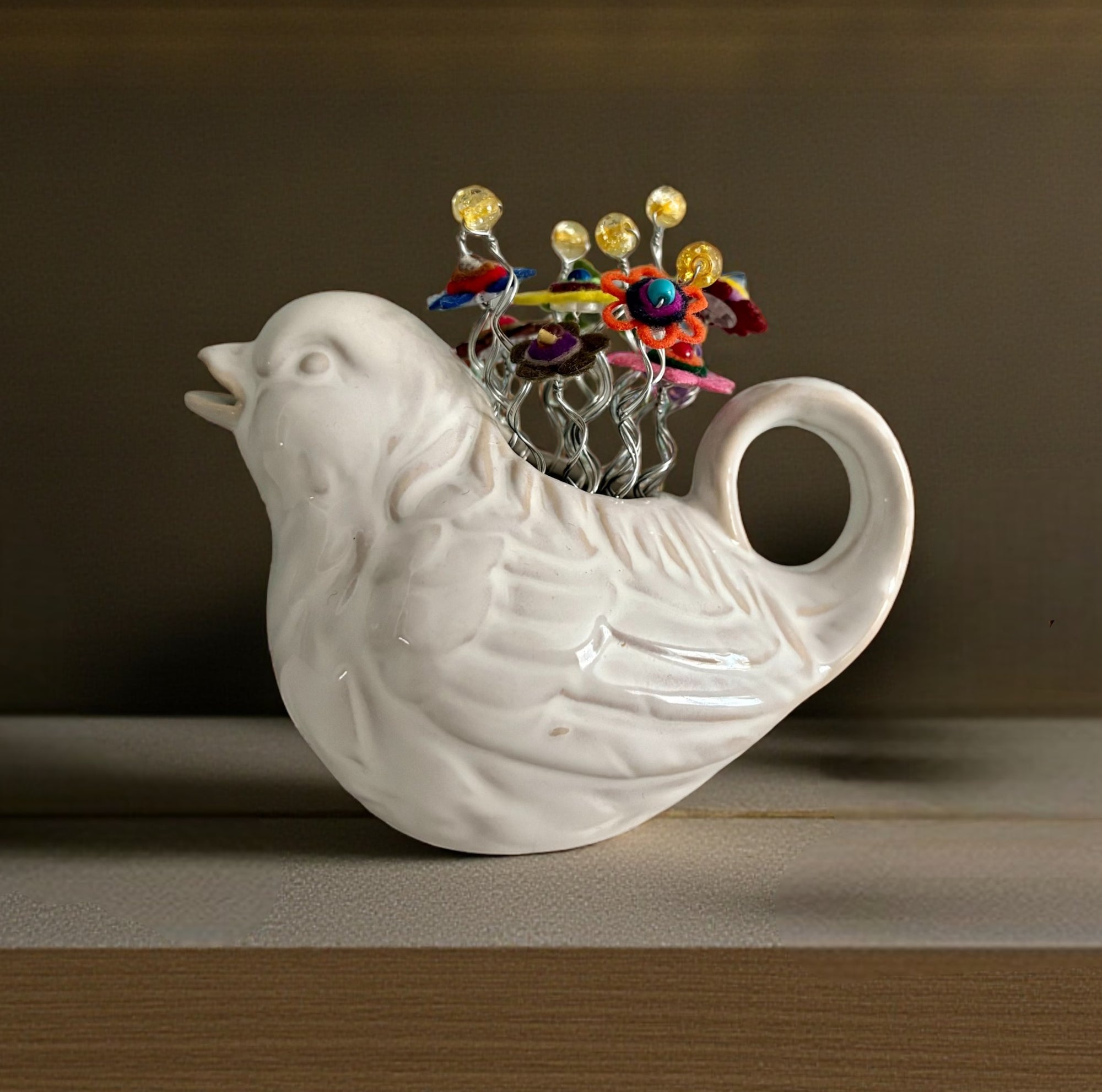White Bird Vase with Multi-Colored Flowers and Yellow Beads