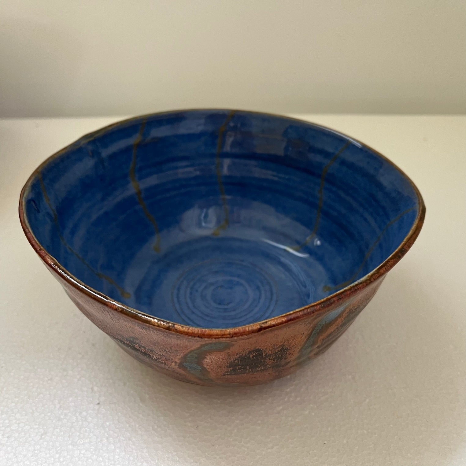 Ribbons of blue and copper-bowls