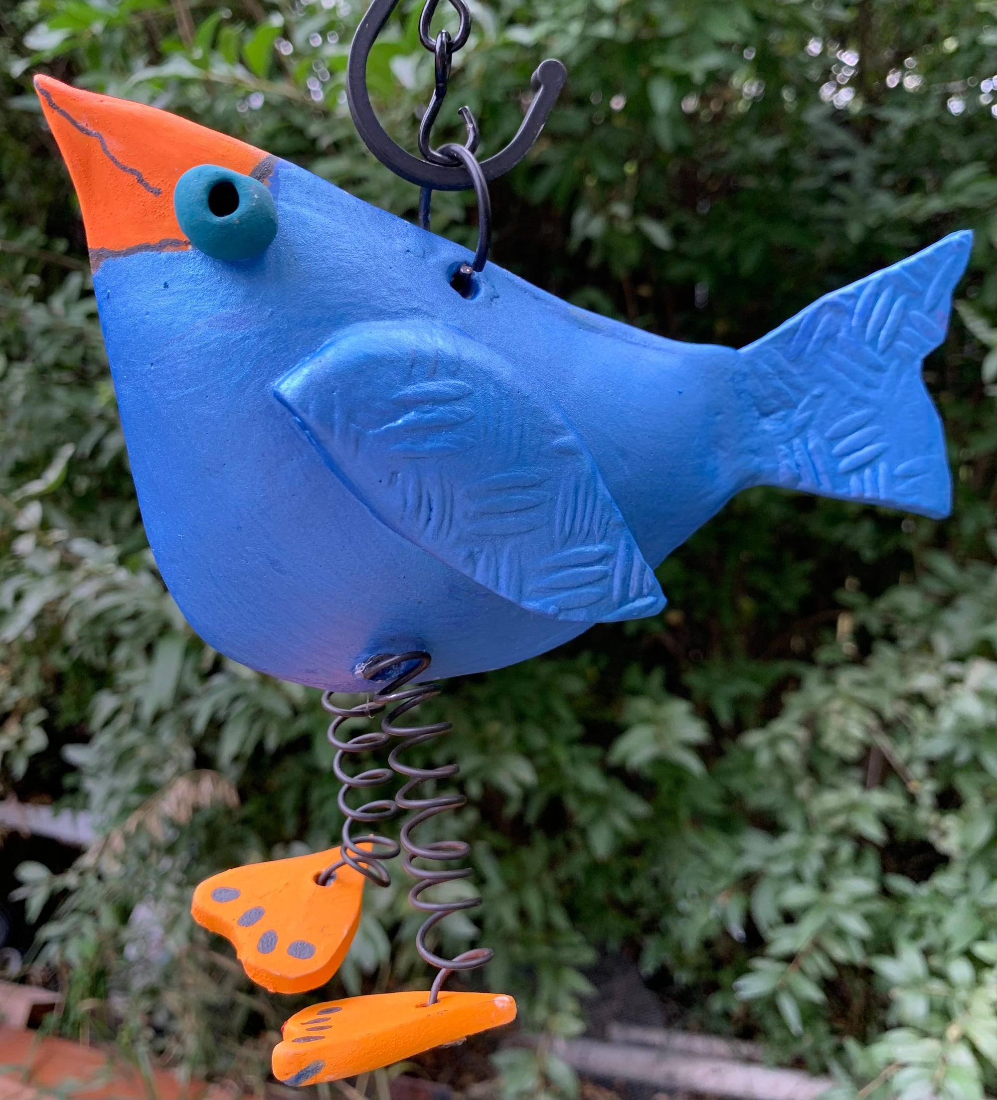 Small orange footed  blue bird